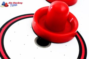 What are the different shapes of air hockey pucks