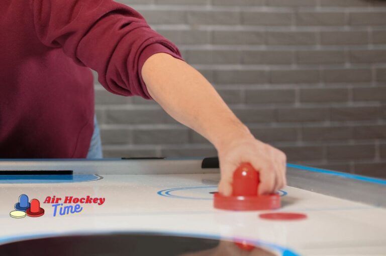 What are the mallets called in air hockey